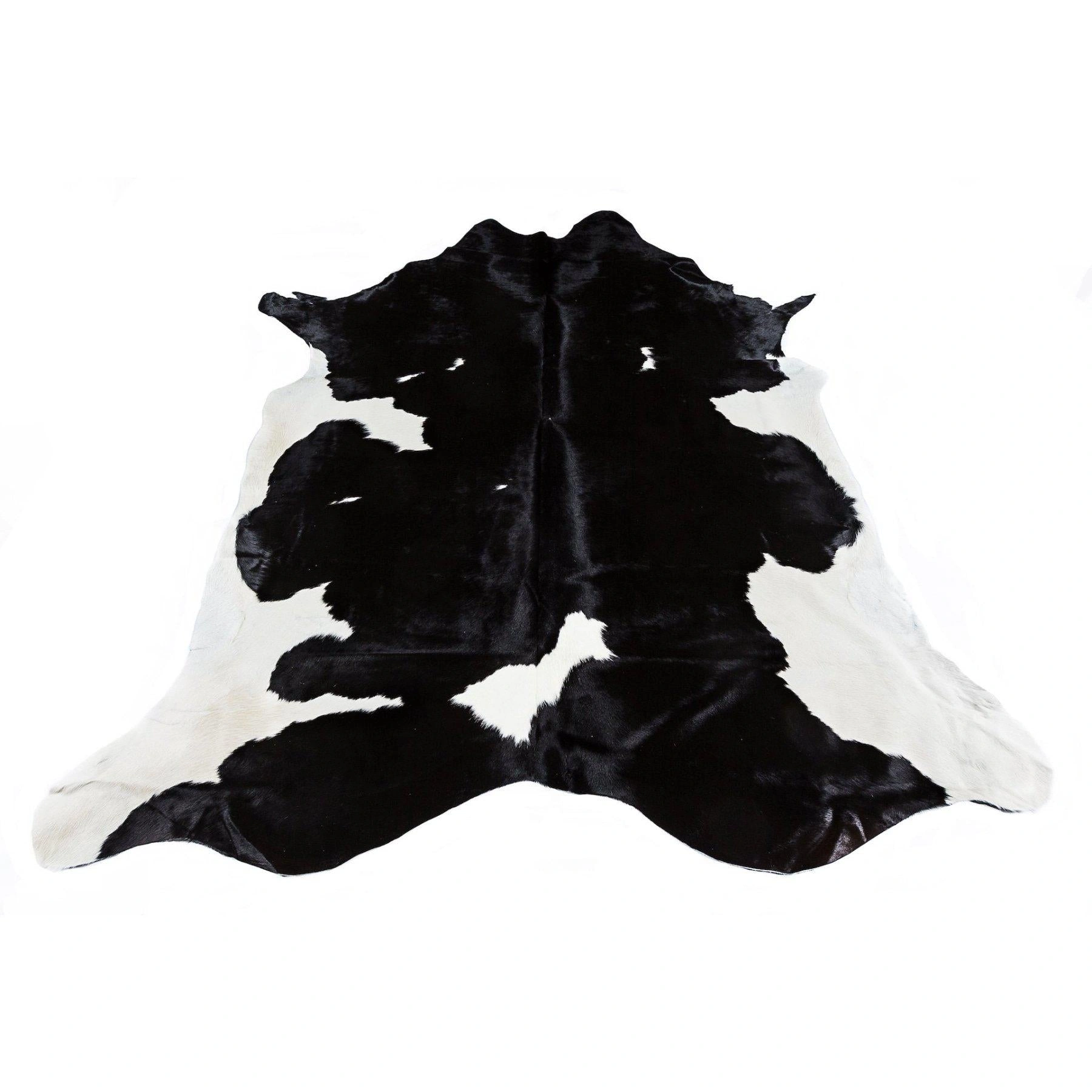 Friesian Black Cowhide: Striking Black & White Rug - Luxurious & Durable.